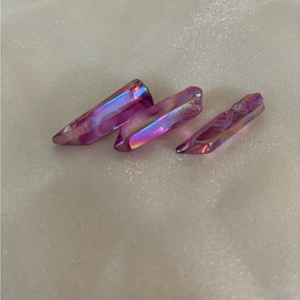 Three pieces of Rose Aura Quartz